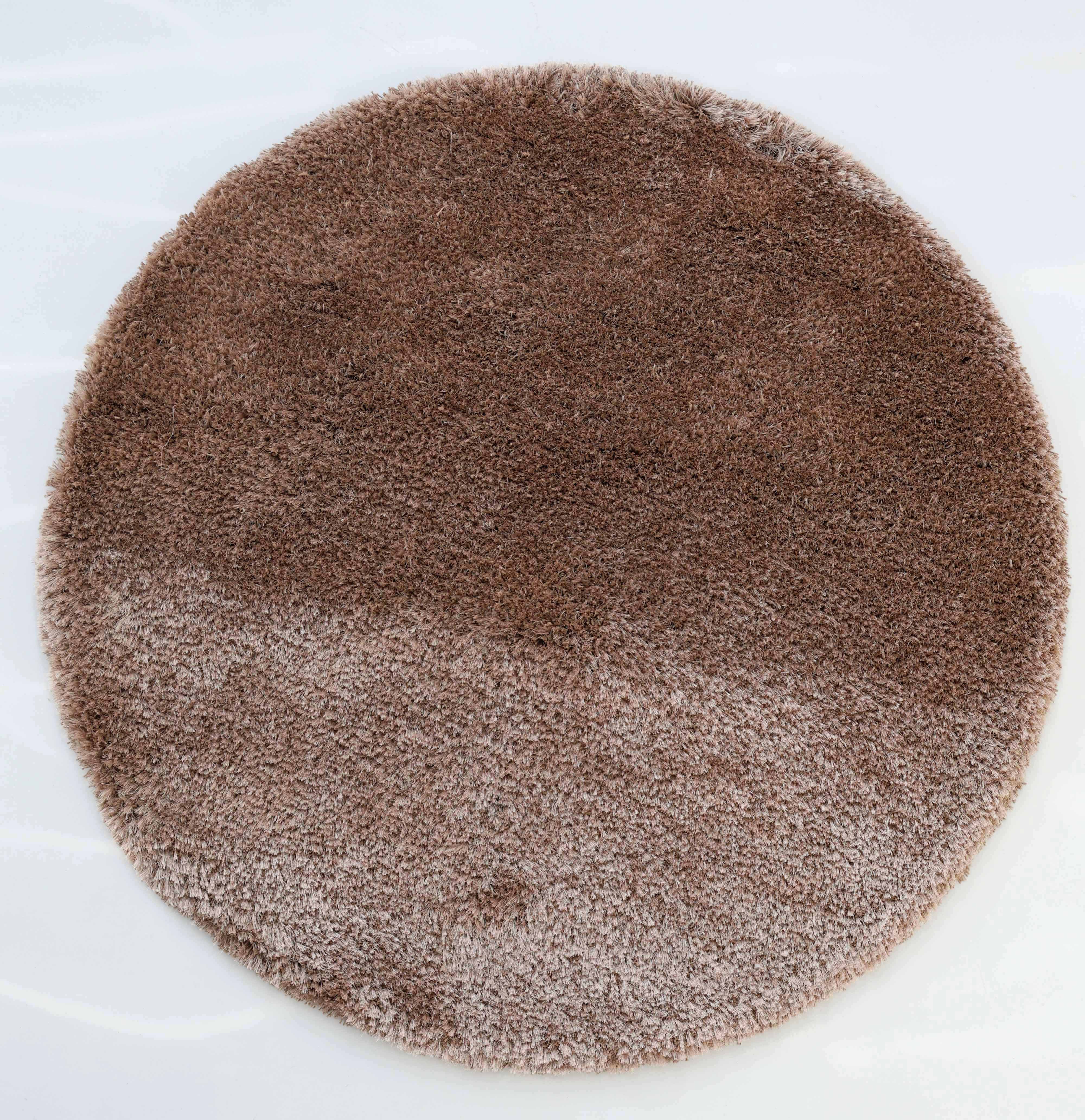 The RAMSHA HOME Soft Plush Brown Shaggy Rug for Living Room (SG 043) is a round, two-tone brown rug featuring a lighter lower half and darker upper half, displayed elegantly on a white surface.