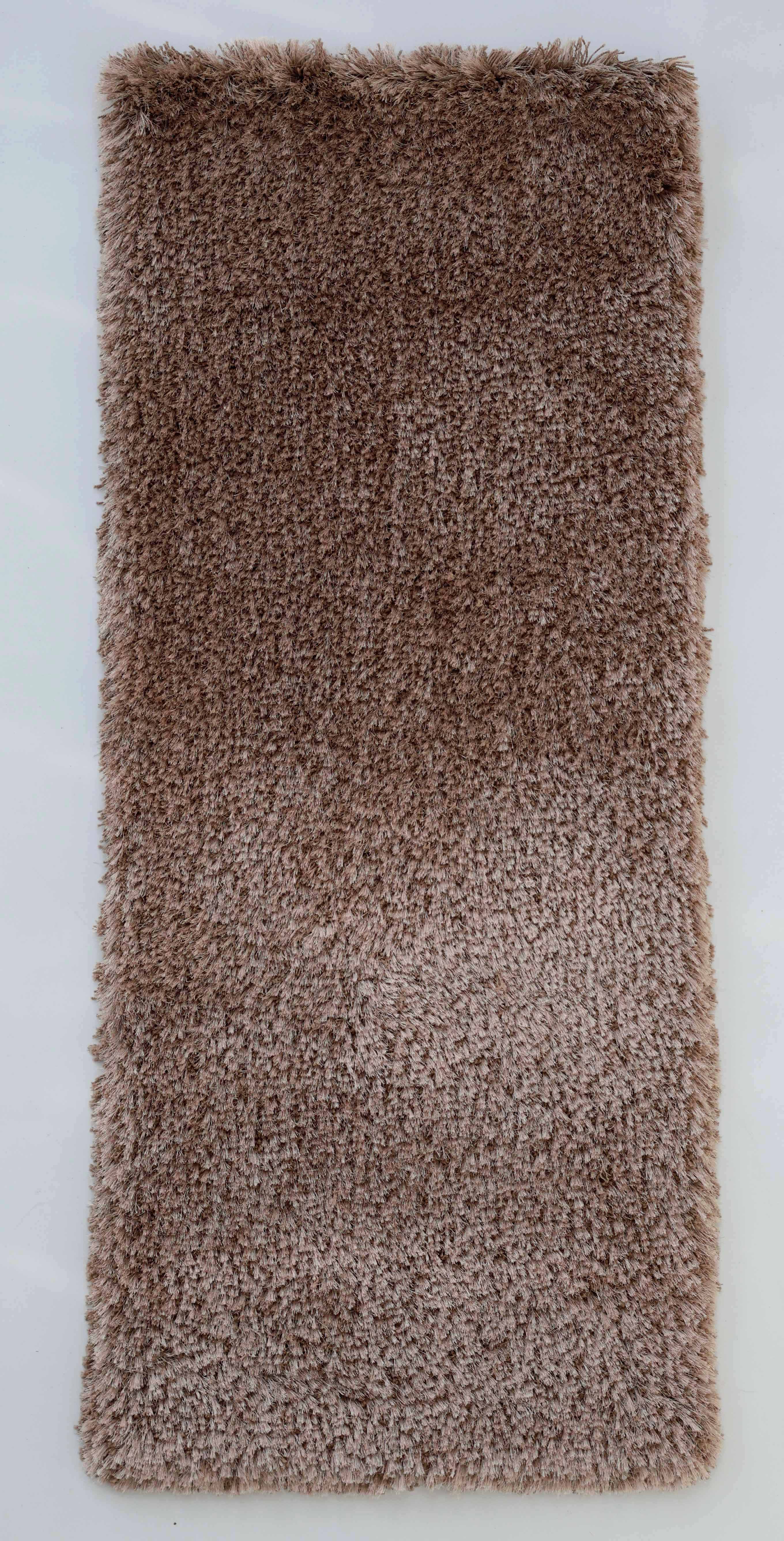 The RAMSHA HOME Soft Plush Brown Shaggy Rug for Living Room - SG 043 is a rectangular rug with a soft, fluffy texture, displayed against a white background.