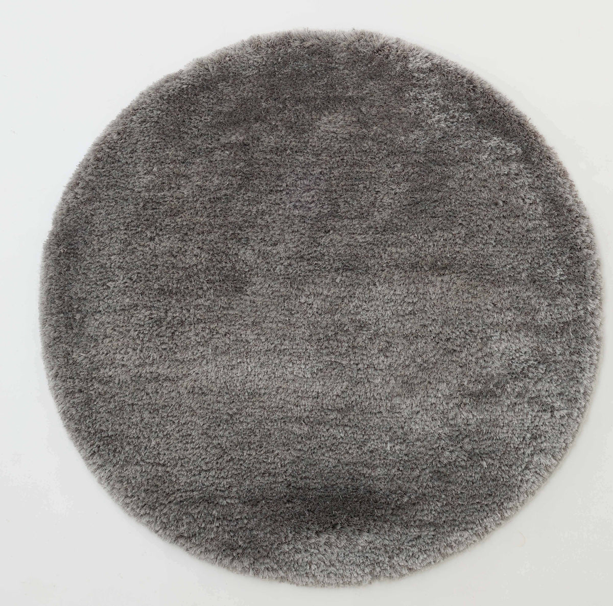 The RAMSHA HOME Soft Plush Grey Shaggy Rug for Living Room (SG 044) is displayed on a white background, showcasing its round shape, fluffy appearance, and soft texture.