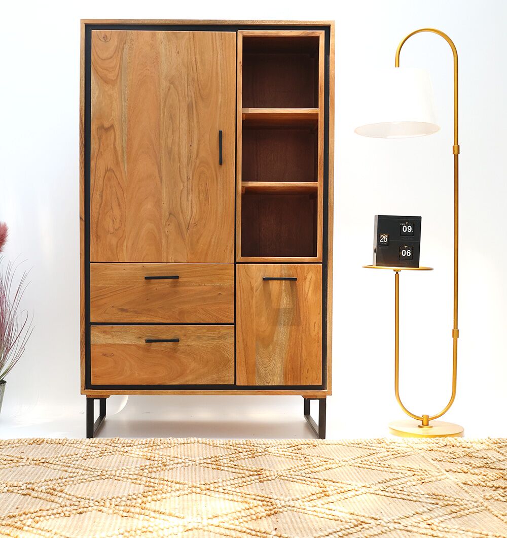 A RAMSHA HOME Handcrafted Acacia Wood Cabinet Almirah with open shelves stands beside a gold floor lamp with a white shade and small digital clock in the living room, atop a beige patterned rug.
