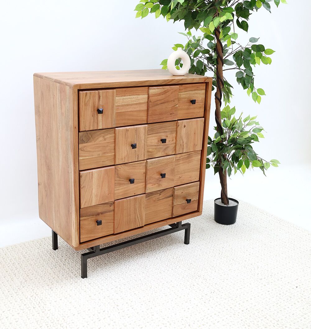 The RAMSHA HOME Natural Acacia Wood Drawer Cabinet – 8 Drawer Cabinet features square-patterned drawers and black handles, standing on a black metal frame beside a leafy potted plant on a light-colored textured rug.