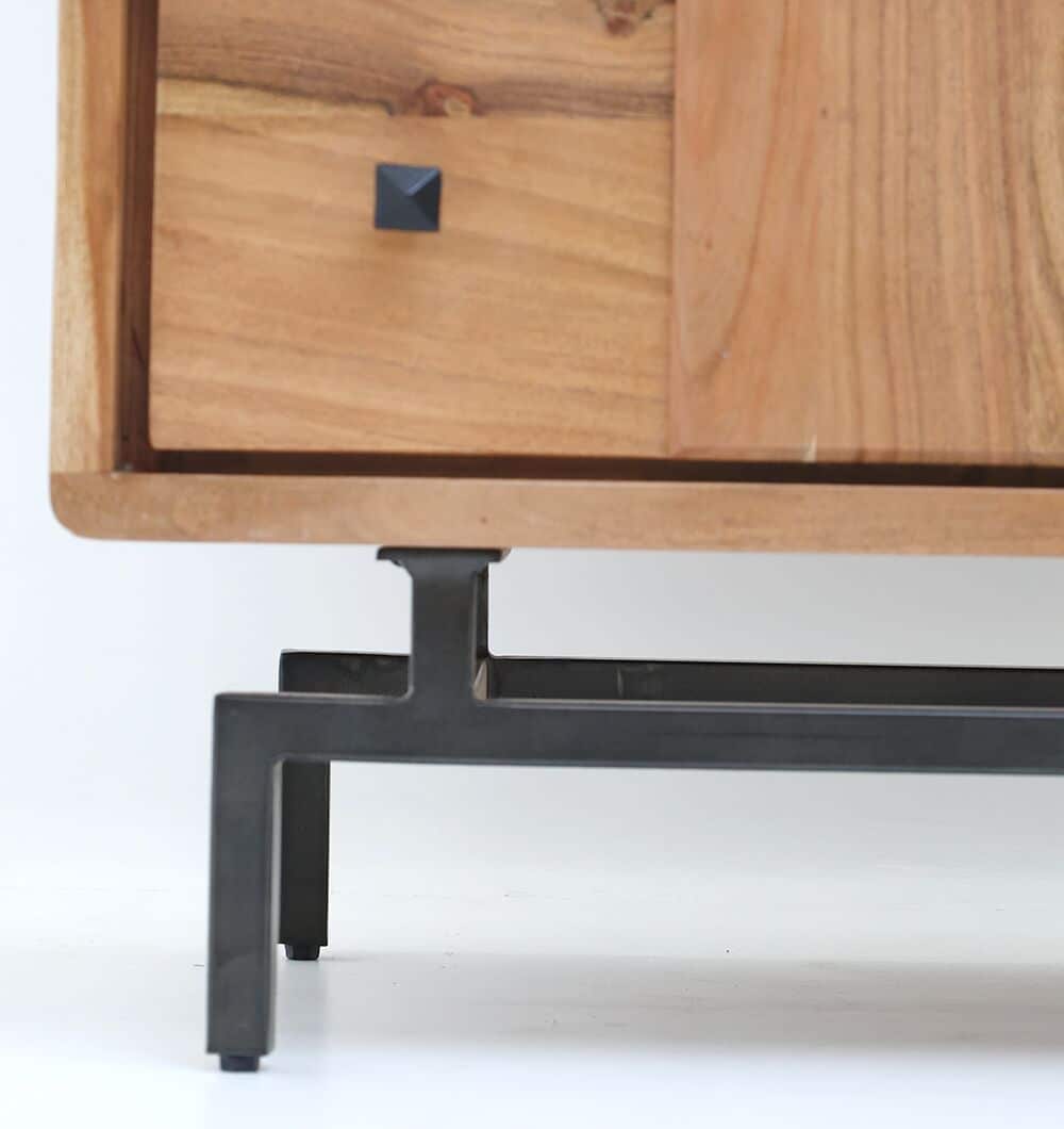 Close-up of the bottom corner of the RAMSHA HOME Natural Acacia Wood Drawer Cabinet – 8 Drawer Cabinet, featuring a black metal leg and a black square handle, set against a plain white background.