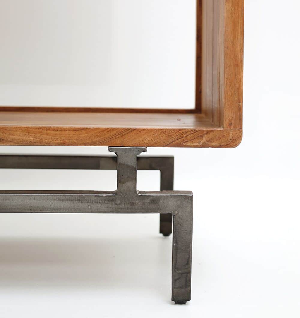 Close-up of the RAMSHA HOME Wooden Book Shelf With Central Cabinet, featuring a metal frame and acacia wood top, showcasing its clean lines and minimalist design against a plain white background.