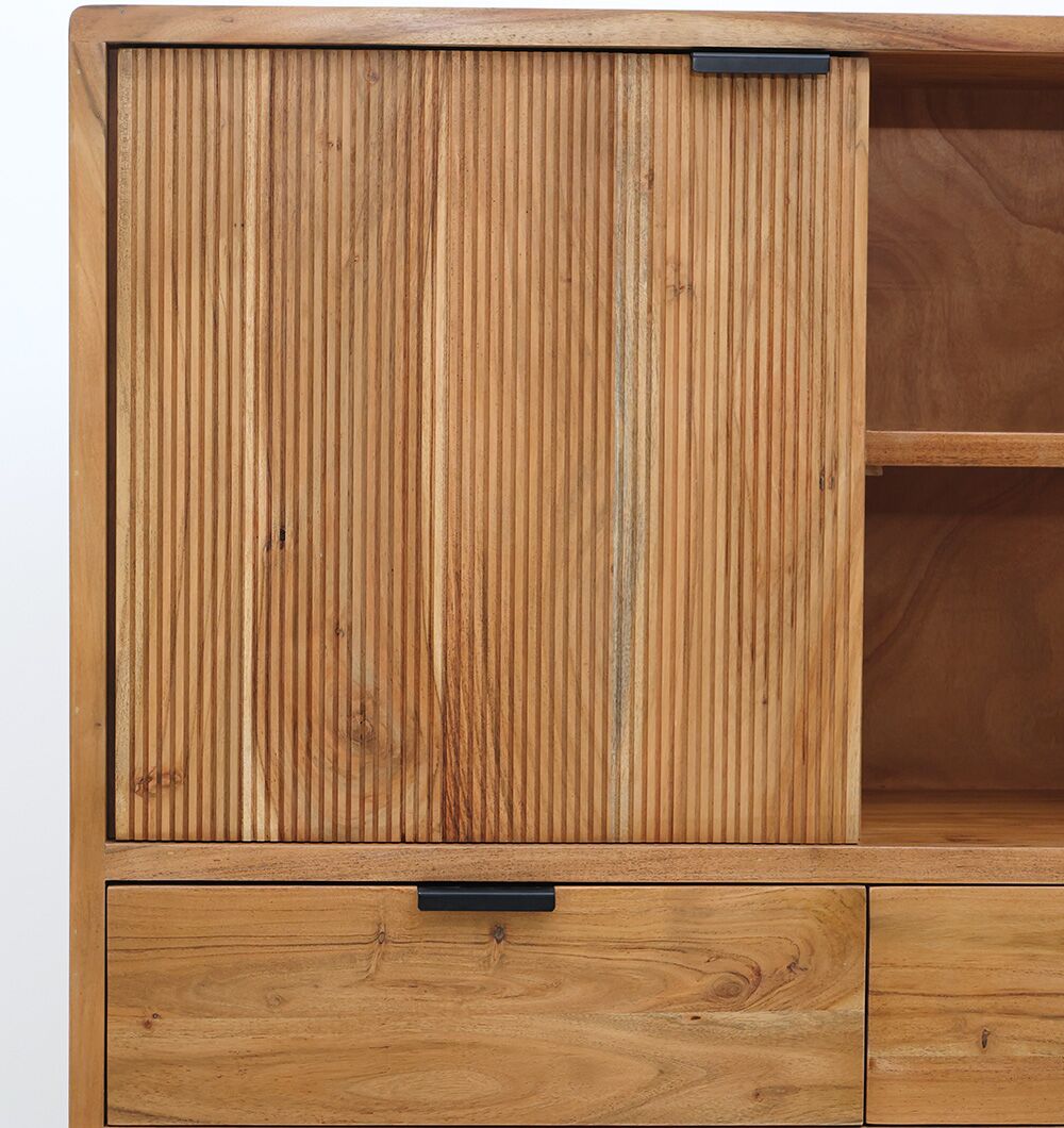 The RAMSHA HOME Handcrafted Acacia Wood Cabinet With Open Shelves showcases vertical grooves on its sliding door, two drawers below, open shelving to the right, a natural finish, and black rectangular handles.