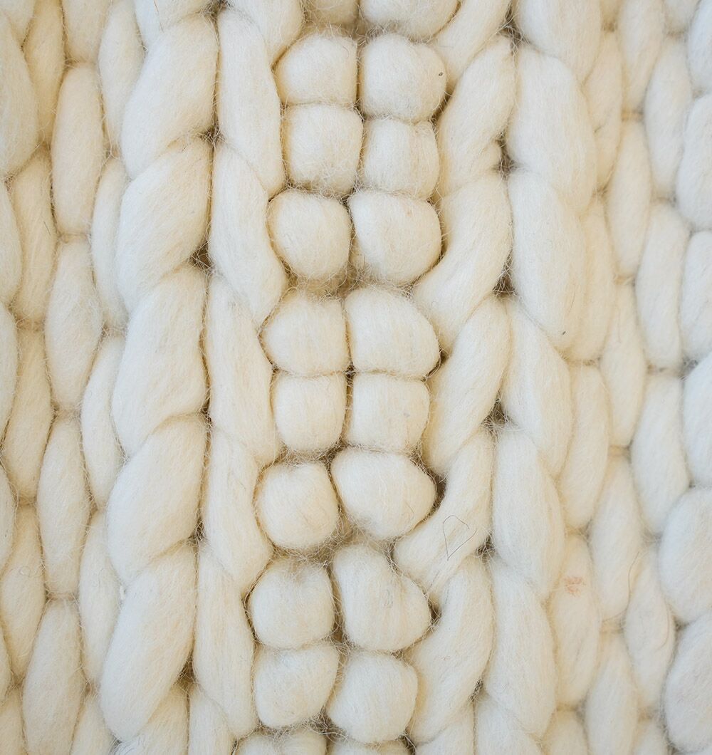 Close-up of the Eid Festive Collection Natural White Rectangle Rug SRN 008 shows thick, cream-colored yarn in a textured knit. Soft, fluffy fibers create a cozy look—ideal for Ramadan décor or as a thoughtful Eid gift.