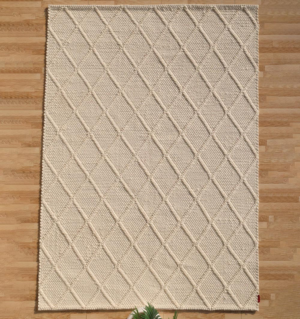 Refined decorative area rug, hand-woven from natural wool and cotton, reflecting artisanal heritage.