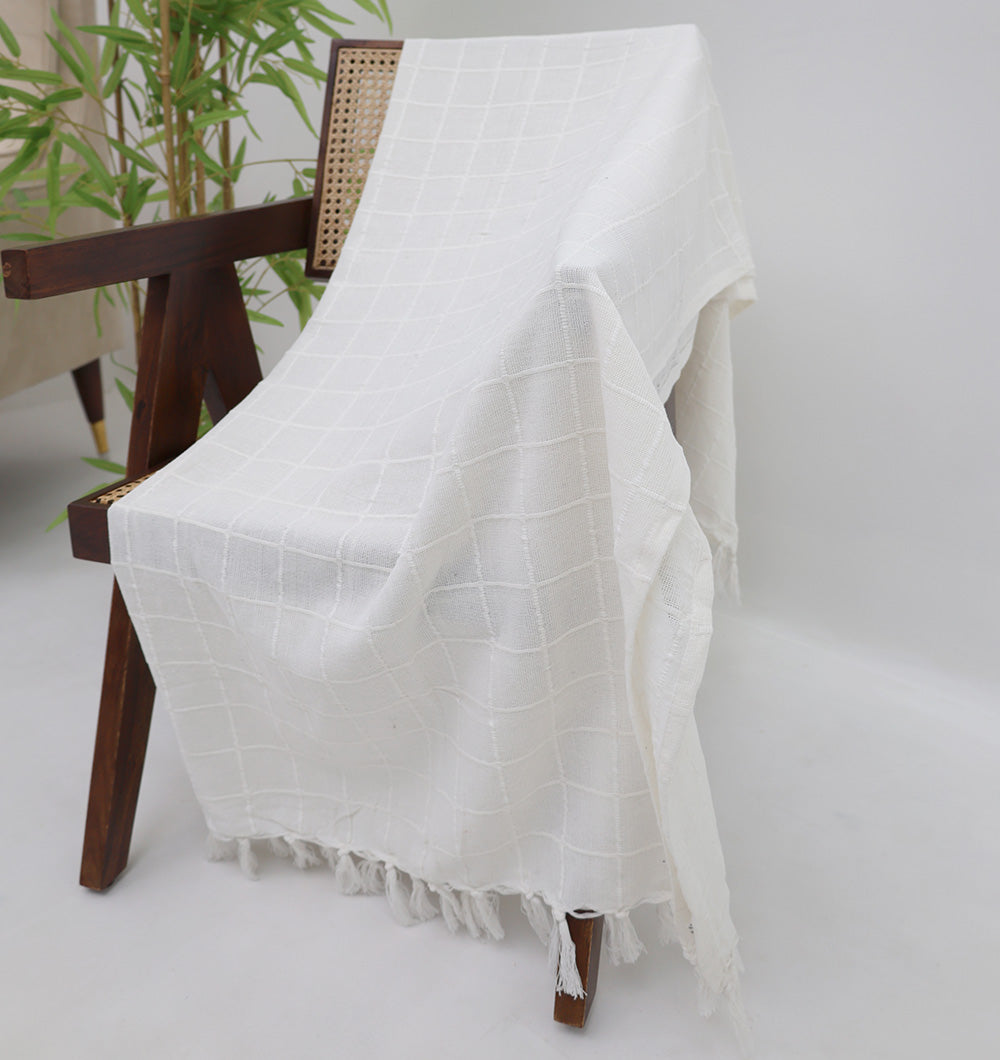 The White Decor Throw TAL 051 (130x160cm) by Ramsha Home adds modern comfort to your space with its subtle grid pattern and fringe edges—perfect draped over a chair or sofa for a stylish touch.