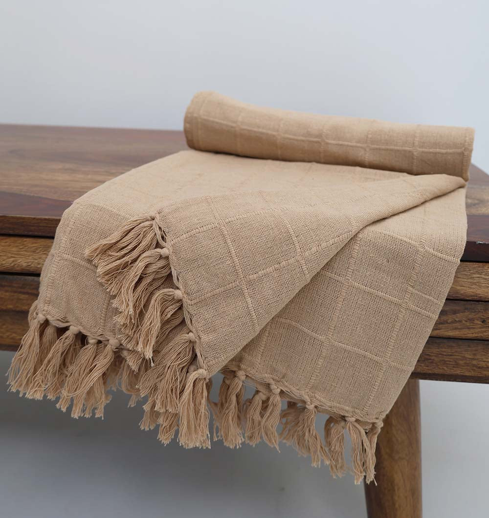 The Living Room Throw Beige Color TAL 052 (130x160cm) by Ramsha Home features a cozy, checkered texture in neutral beige, reminiscent of a cotton throw, perfect for adding subtle elegance to your table or living space.