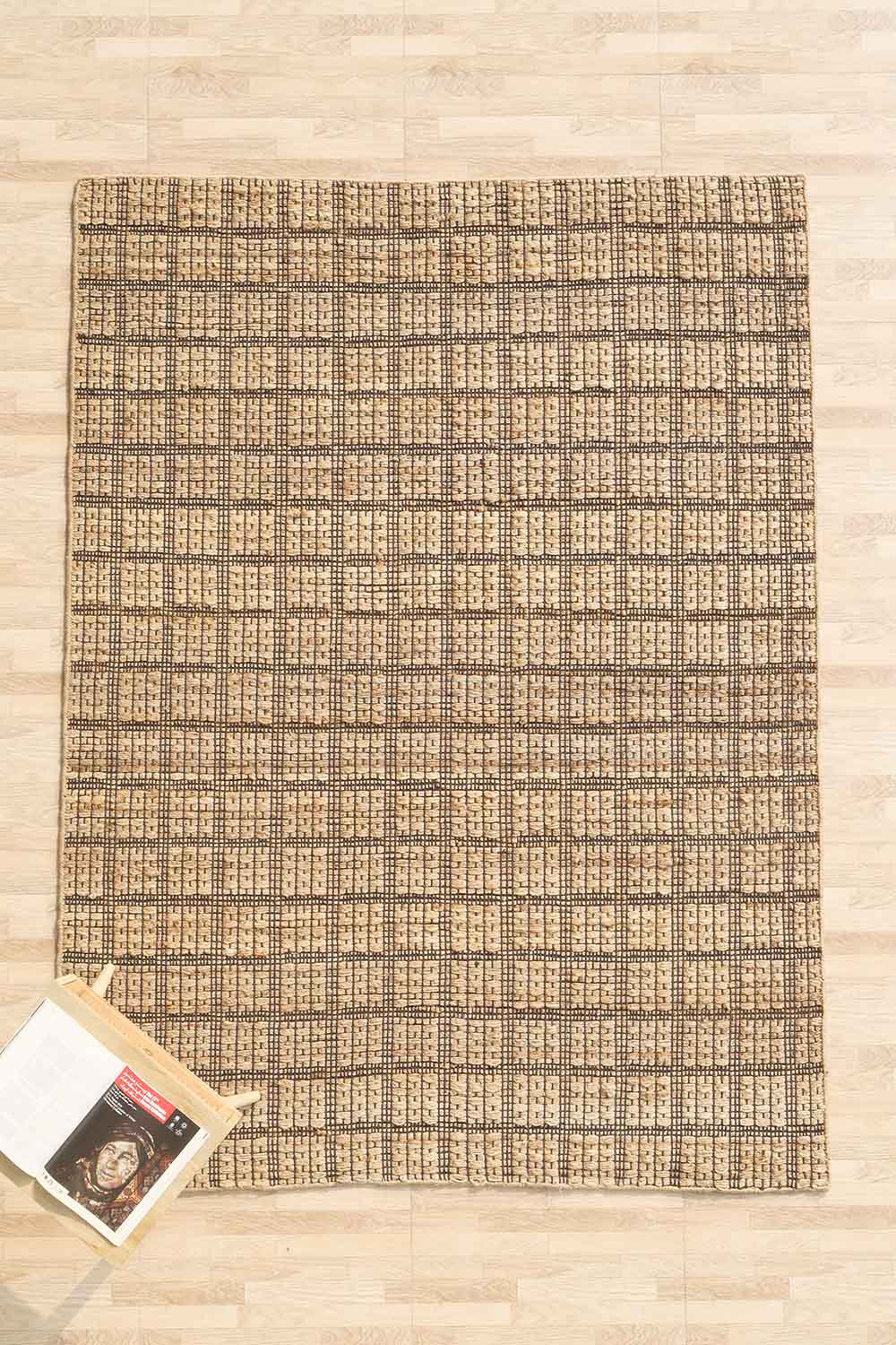Decorative hand-woven natural fiber rug, crafted from durable Jute to bring warmth and texture to the space.