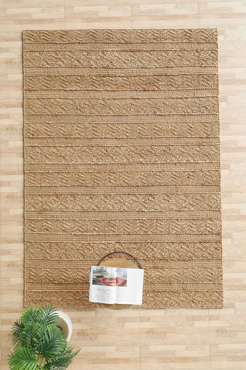 Expertly hand-woven area rug with organic texture in serene natural colorations.