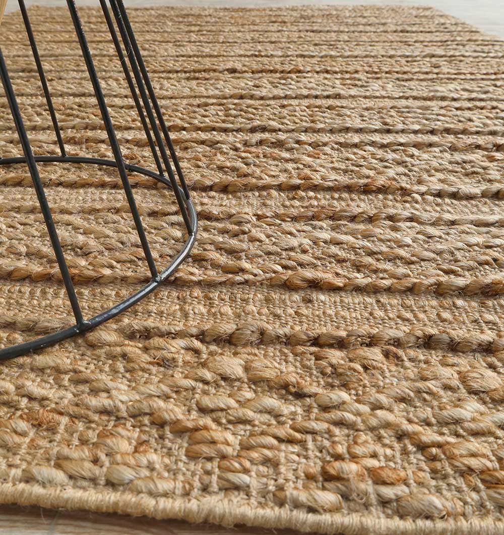 Close-up of the expertly woven texture next to decorative items, emphasizing its visual distinction.