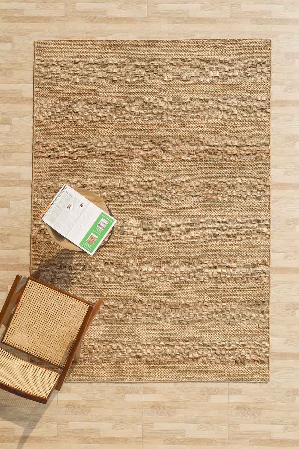 Hand-woven area rug crafted from natural jute fibers, perfect for transforming a living space.