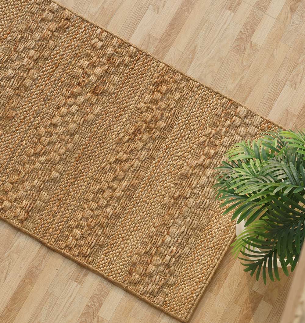 Perspective shot emphasizing the breathable nature of the natural jute rug material.