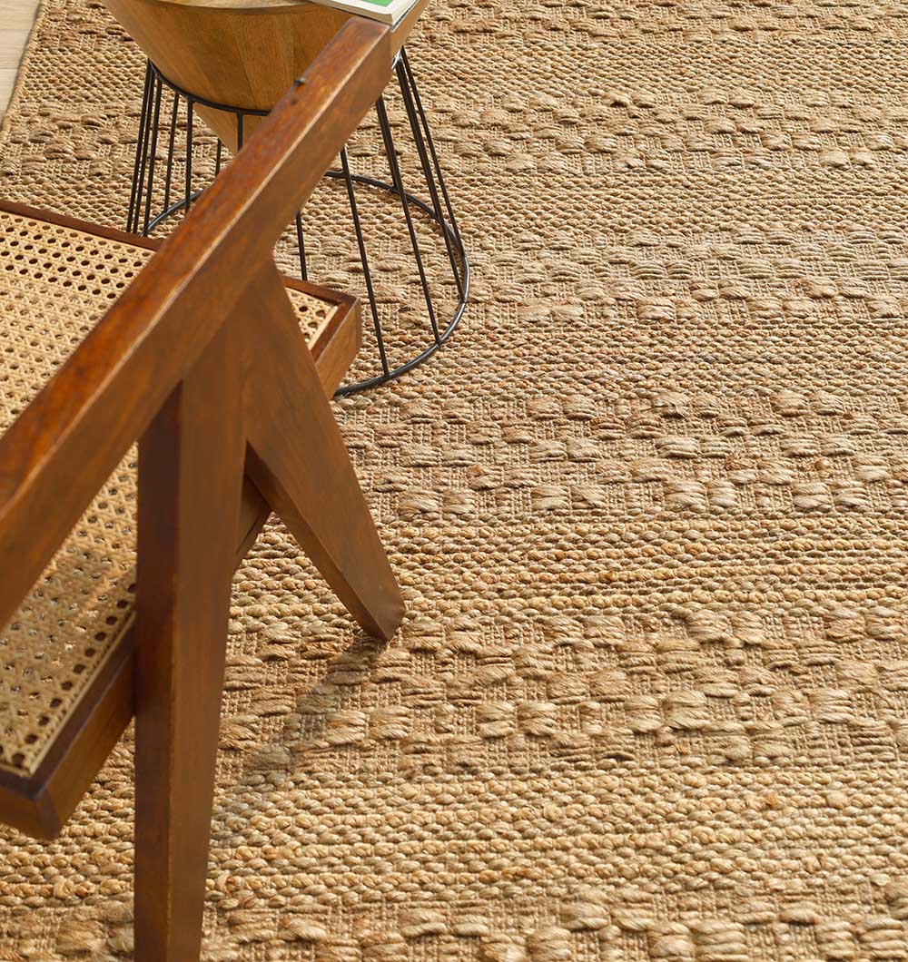 Close-up of the tightly woven jute pattern, reflecting meticulous craftsmanship and natural warmth.