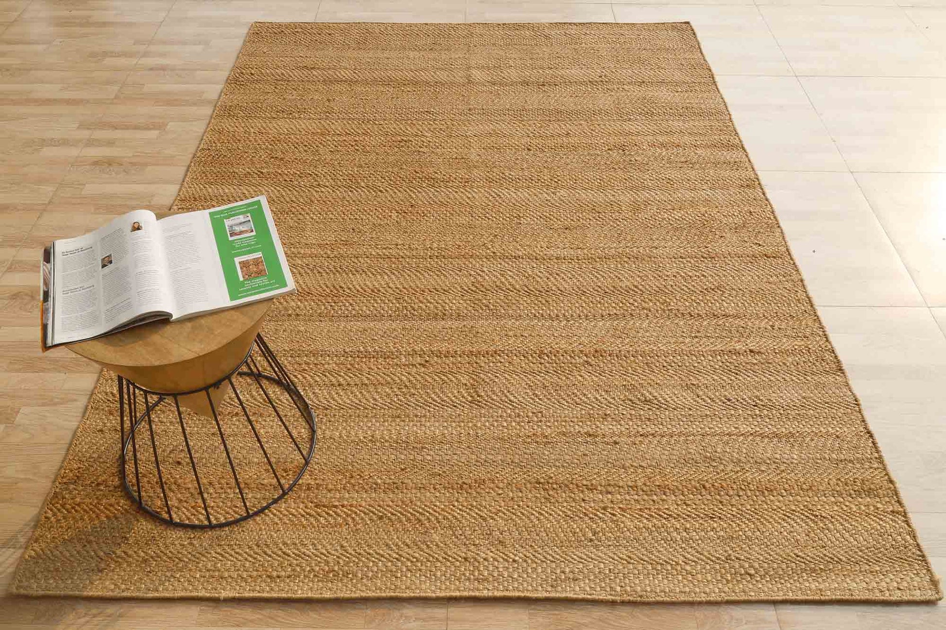 Hand-woven Jute rug providing organic warmth and a natural color palette for the main living area.