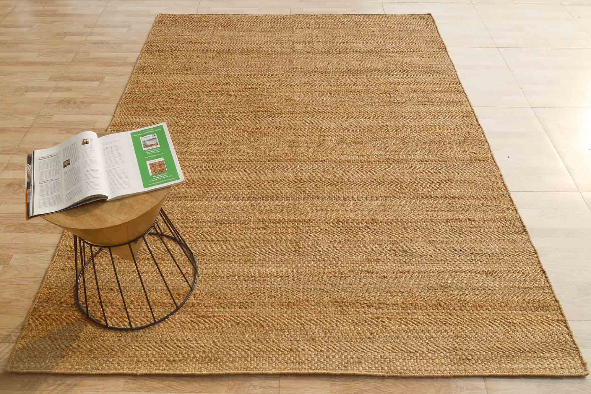 Hand-woven Jute rug providing organic warmth and a natural color palette for the main living area.