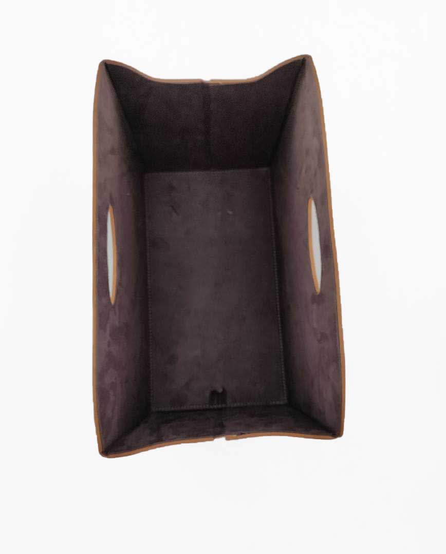 The Ramsha Home Tan Handmade Polyester Basket (BK 001, 35x20x27cm) features cut-out handles on the short sides and a rectangular design, ideal for versatile storage and home organization, shown from above against a white background.