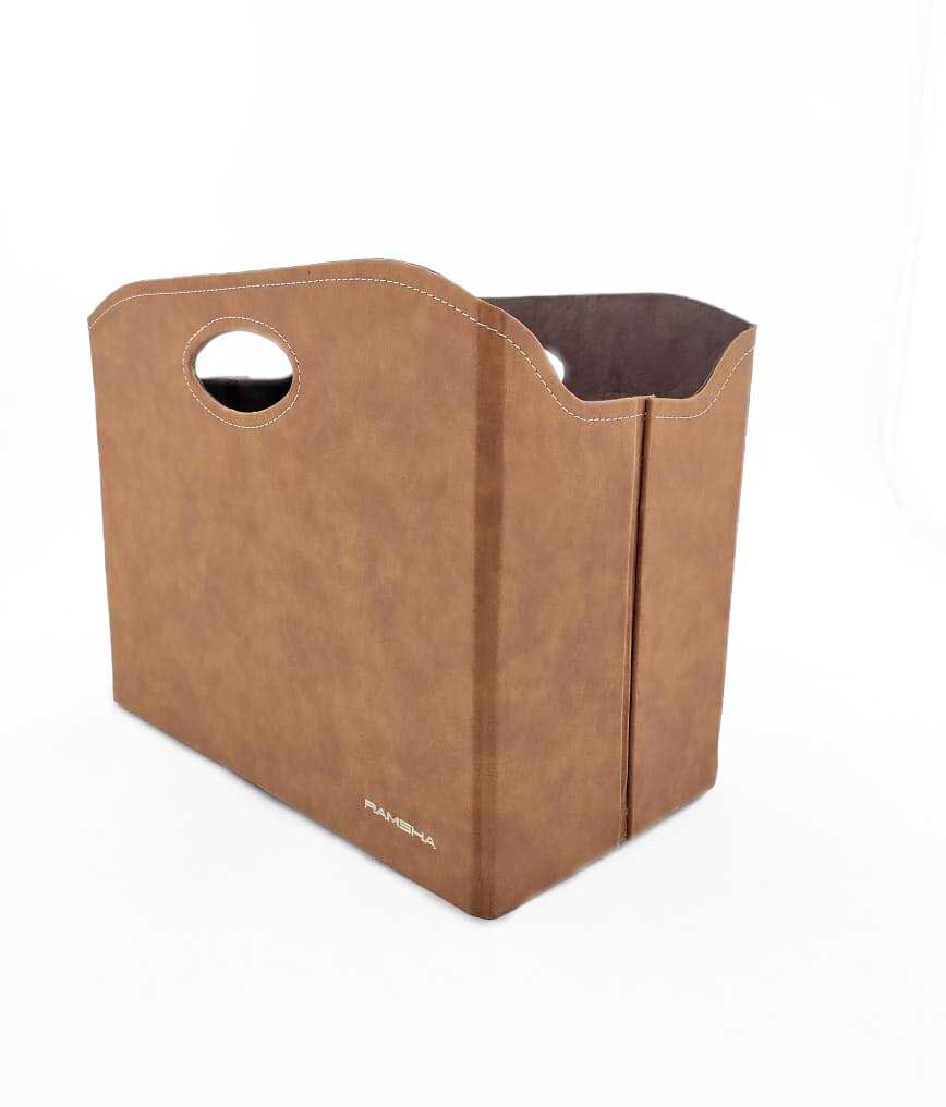 The Tan Handmade Polyester Basket - BK 001 (35x20x27cm) from Ramsha Home offers versatile storage for home organization, featuring a stylish design perfect for any space.
