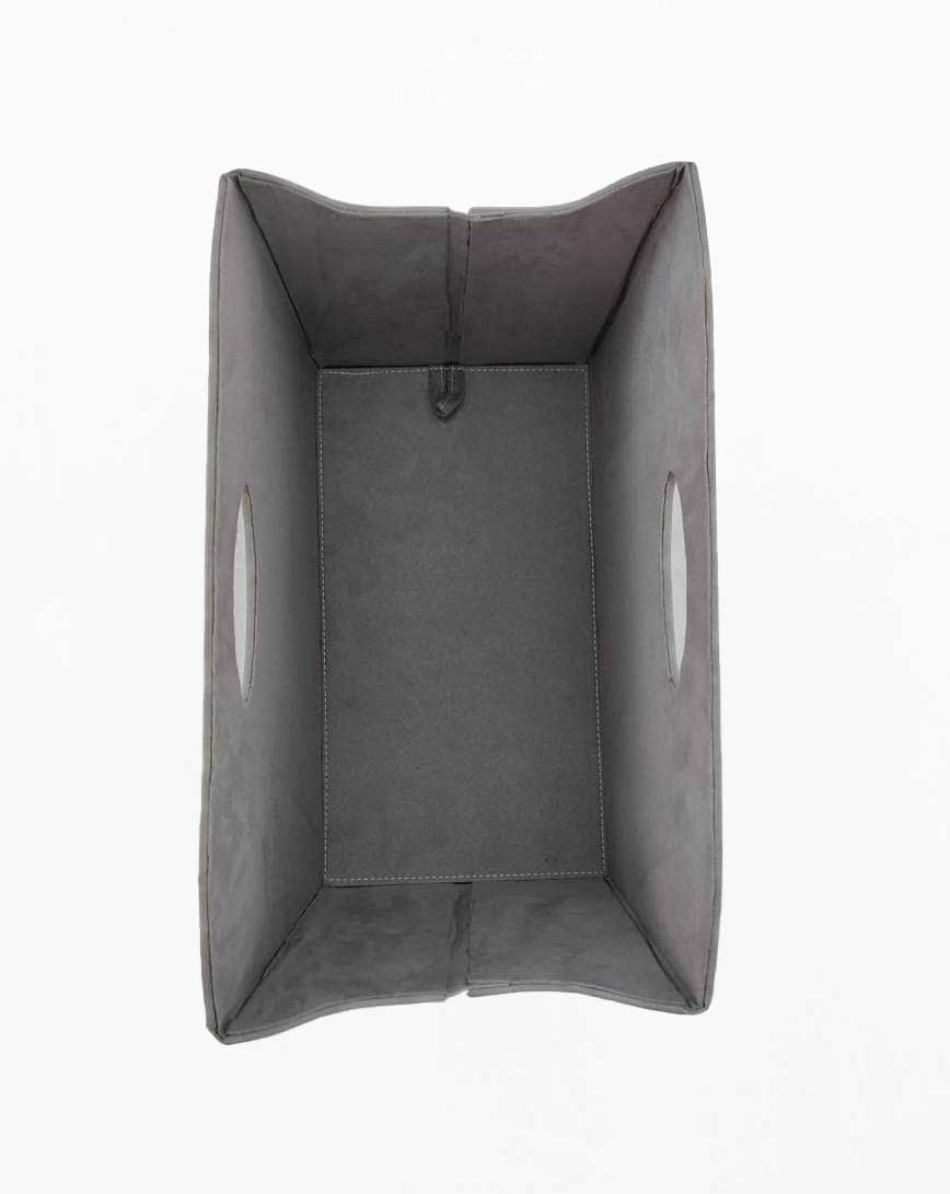 The Grey Handmade Polyester Basket - BK 002 (35x20x27cm) from Ramsha Home features two oval cutout handles, shown empty from above on a white background—ideal for stylish home organization in the UAE.