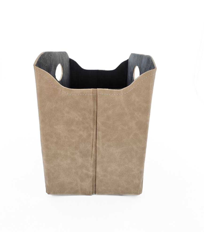 The Ramsha Home Ivory Handmade Polyester Basket (BK 003, 35x20x27cm) features round cutout handles and a black interior, perfect for versatile storage and stylish home organization.