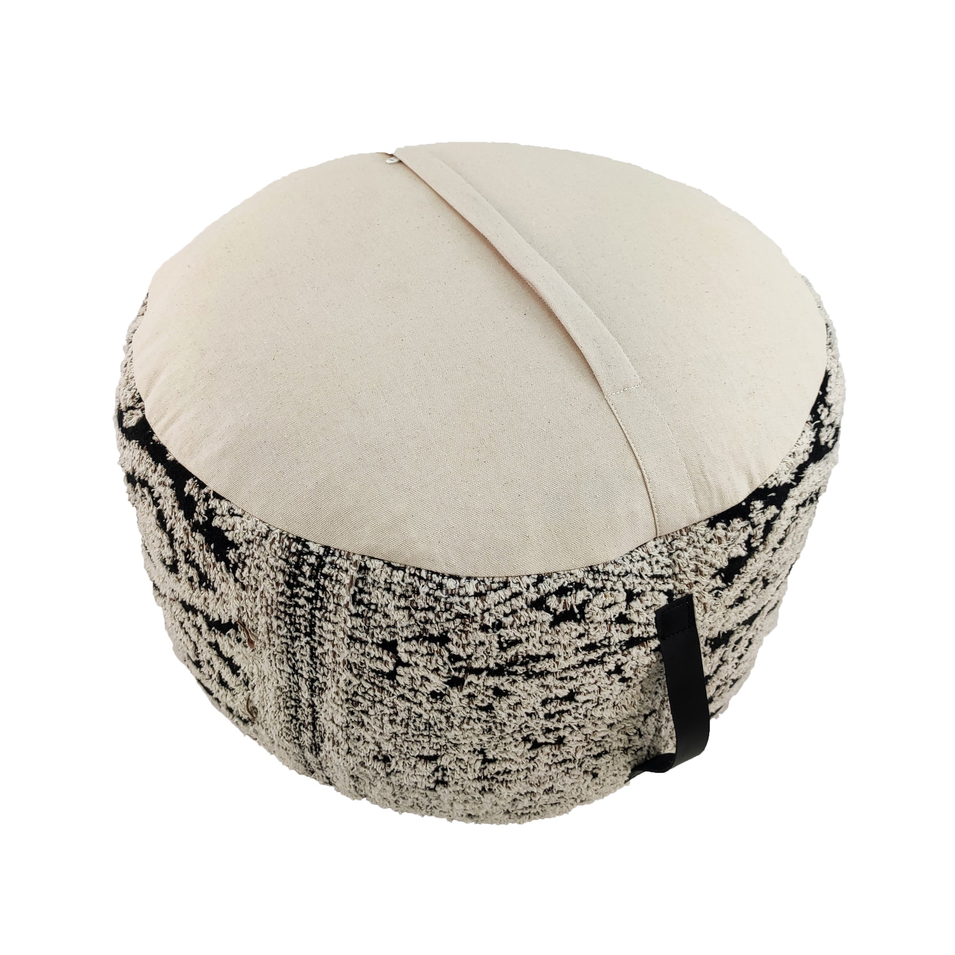 Back view of black & white pouf showing woven cotton fabric and handle