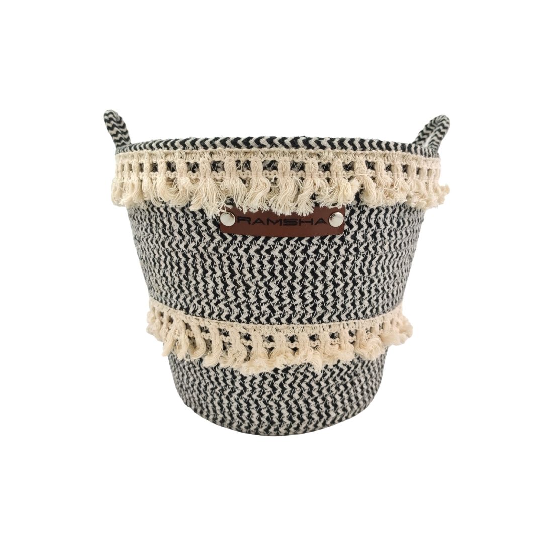 The Ramsha Home White and Black Handmade Cotton Basket with Handle (BS 009, 25x20x25cm) is ideal for nursery organization or as a toy storage basket, adding a stylish touch to your space.