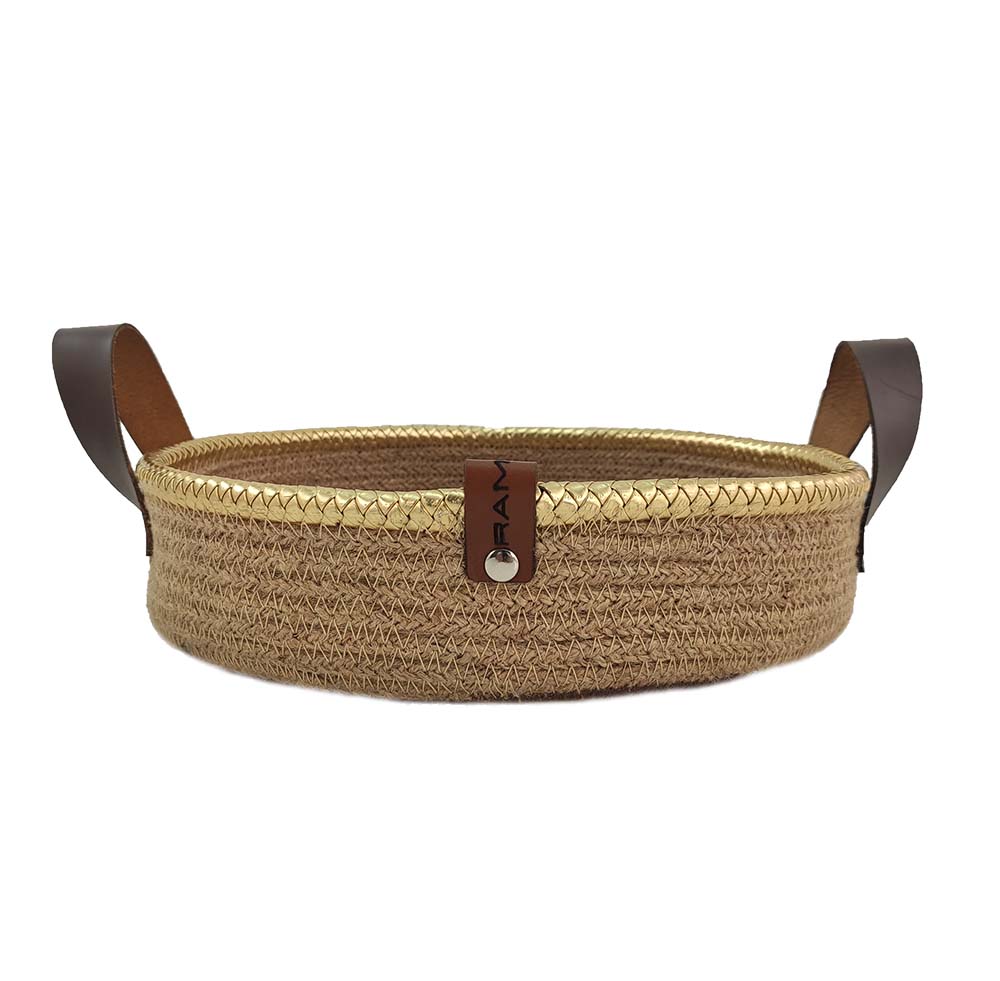 The Ramsha Home Natural Jute Basket with Leather Handle (BS 011, 28x7cm) features brown leather handles and a branded tag—ideal as a stylish kitchen organizer. Displayed on a white background.