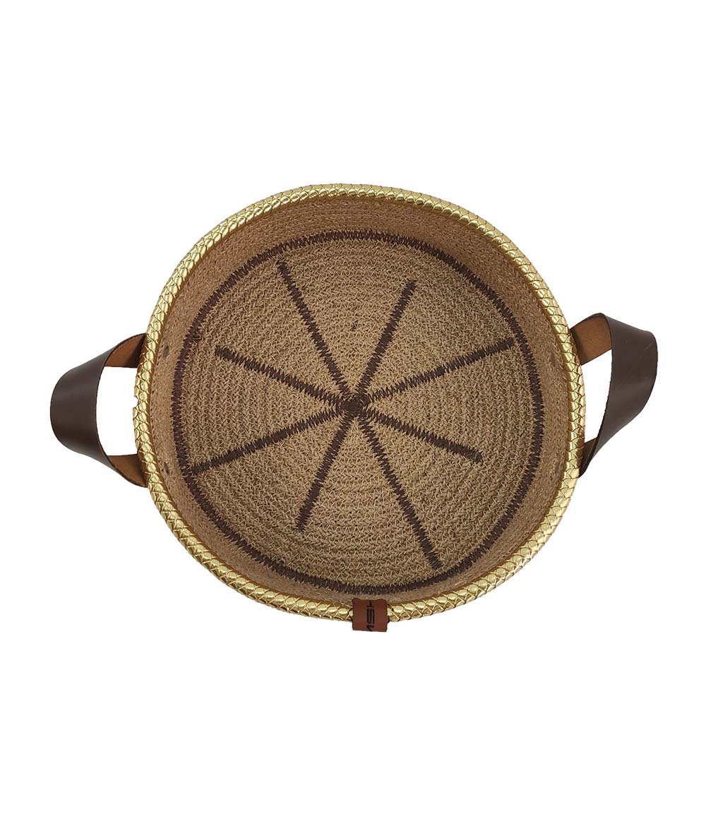 The Natural Jute Basket with Leather Handle- BS 011 (28x7cm) from Ramsha Home features a starburst center, braided trim, and two leather handles—ideal for storage or as a stylish kitchen organizer.