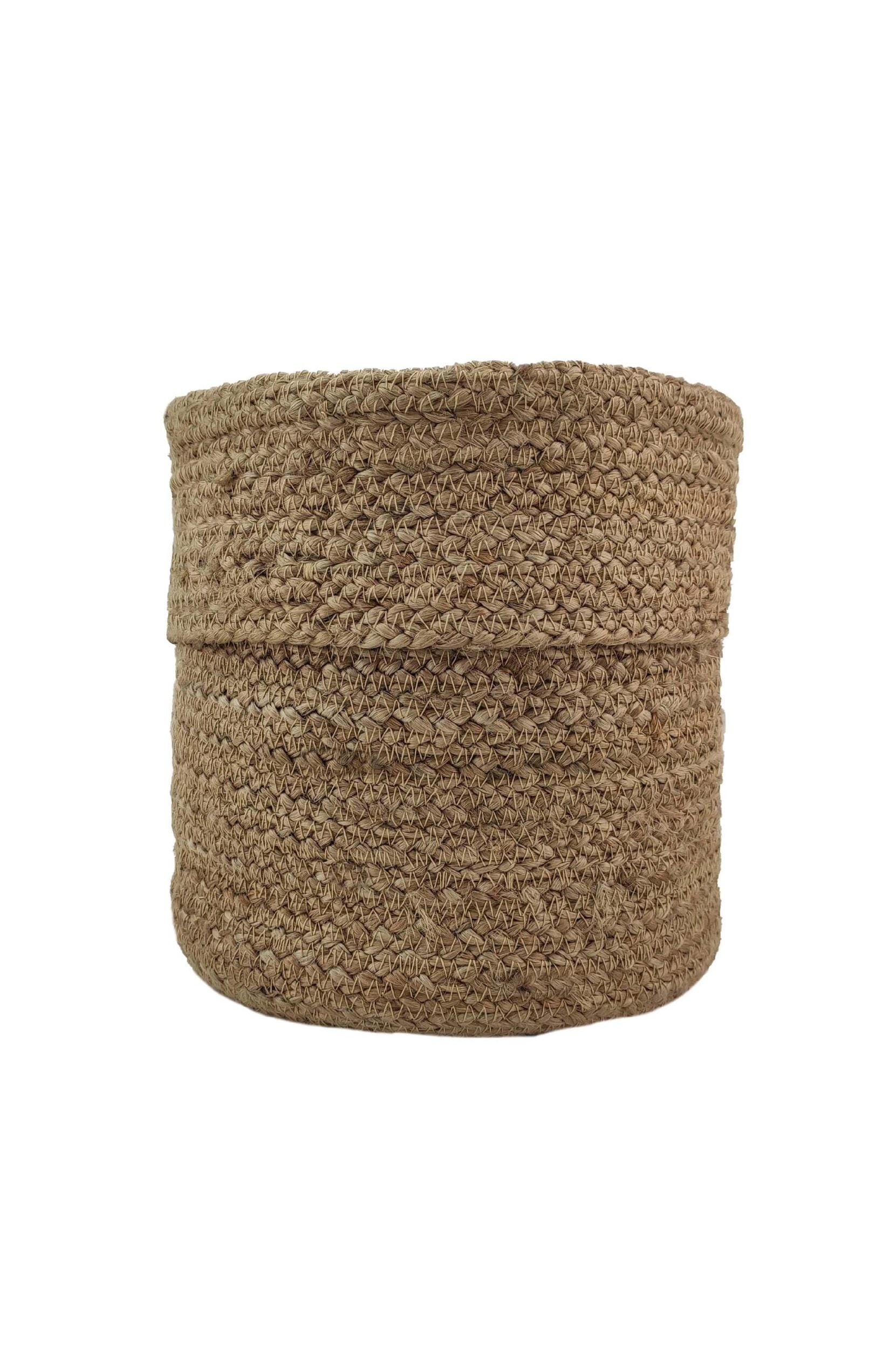 The Natural Handmade Jute Basket - BS 016 (20x30cm) by Ramsha Home features a round, handleless design with textured beige fibers—an eco-friendly storage basket from a luxury furnishings brand in the UAE, shown against a white background.