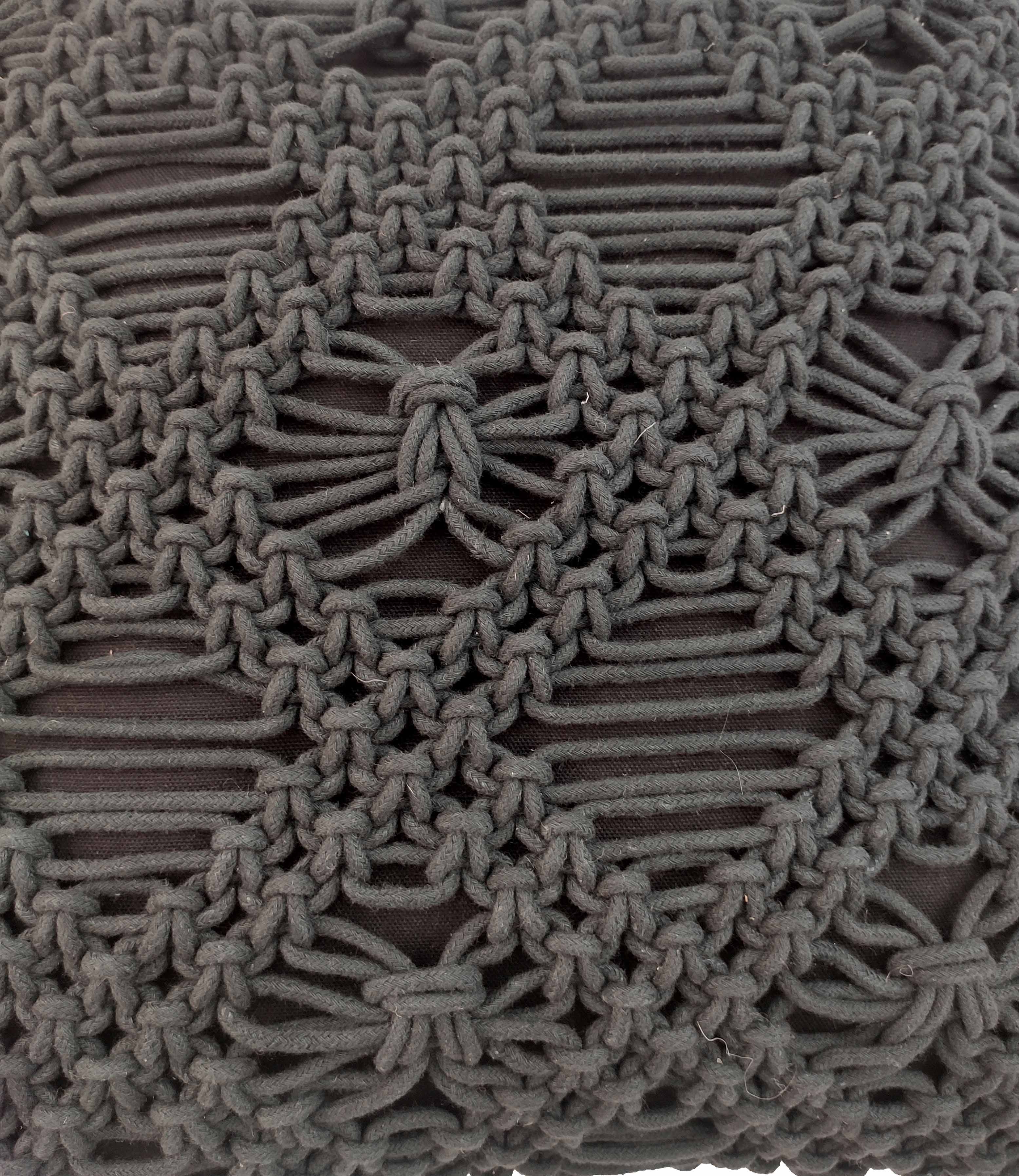 Close-up of RAMSHA HOME's Macrame Cotton Cushion With Filler, featuring textured dark gray macramé with intricate geometric and floral-like knots over a black background—ideal as a decorative cushion or pillow.