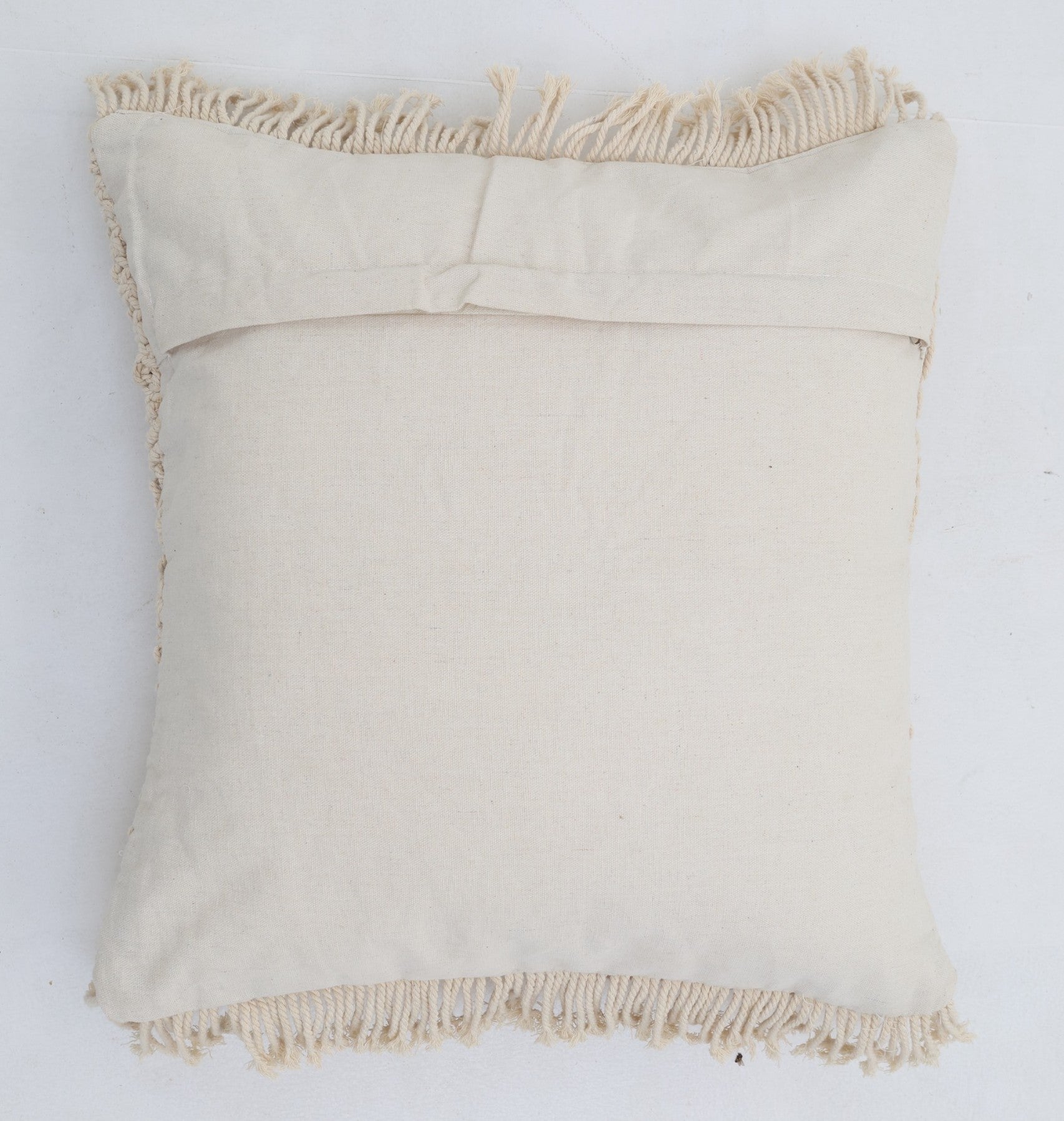 The Natural White Macrame Cushion - CS 311 by Ramsha Home features fringe edging on all sides and a plain back with a horizontal overlapping flap, shown here on a white background.