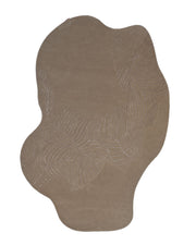 The Natural White Color Handmade Area Rug - HTWV-137 (200x300 cm) from RAMSHA HOME features an irregular shape in a soft beige shade, with subtle, wavy embroidered patterns forming abstract lines for a modern, organic look across its wool surface.