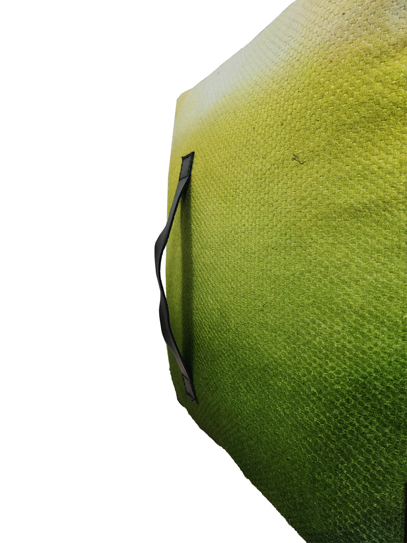 Close-up of green pouf showing soft wool-cotton woven texture