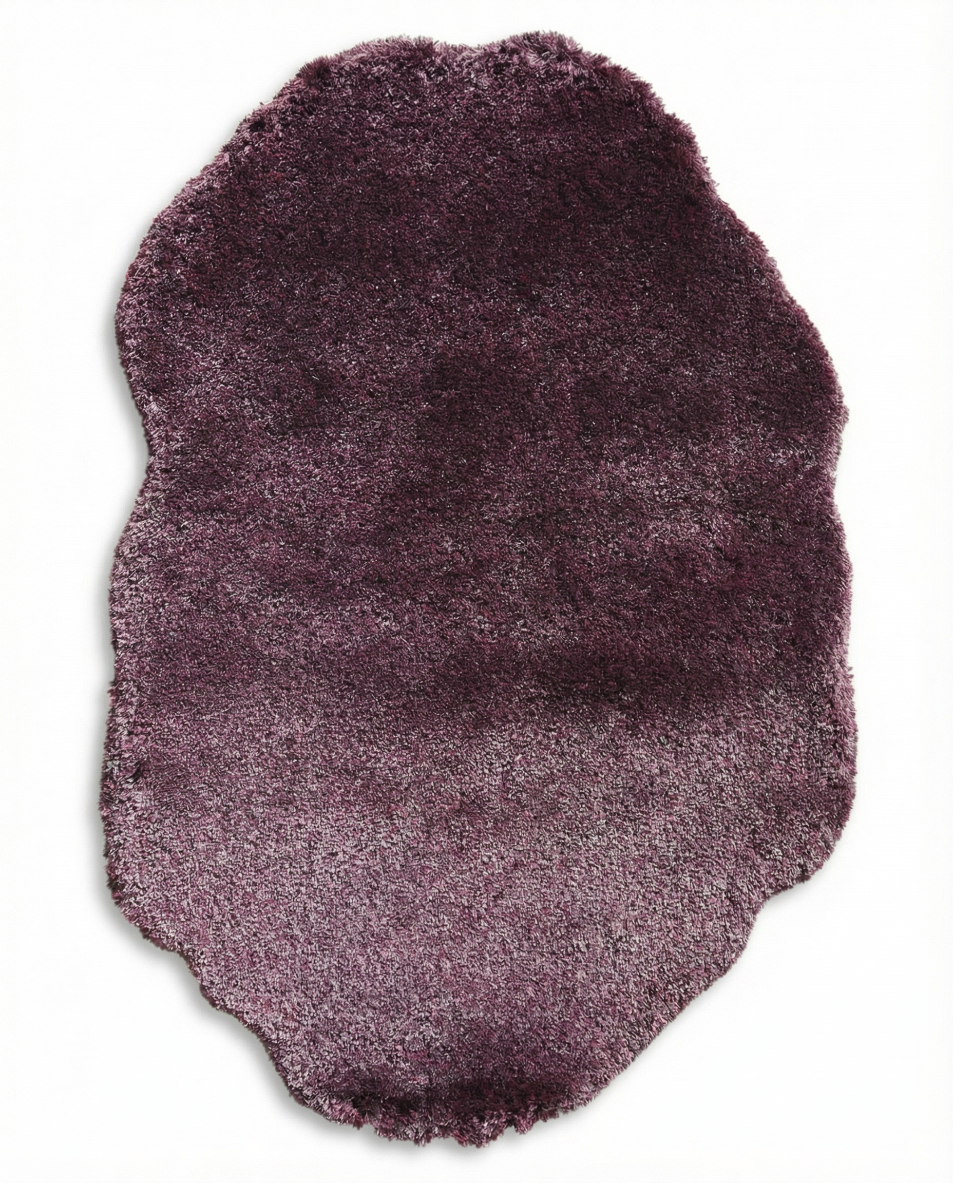 The RAMSHA HOME Shaggy Rug for Living Room (SG 019) features a plush, irregular shape with deep purple shades fading to lighter edges, creating a cozy accent perfect for any space. Displayed on a white background.