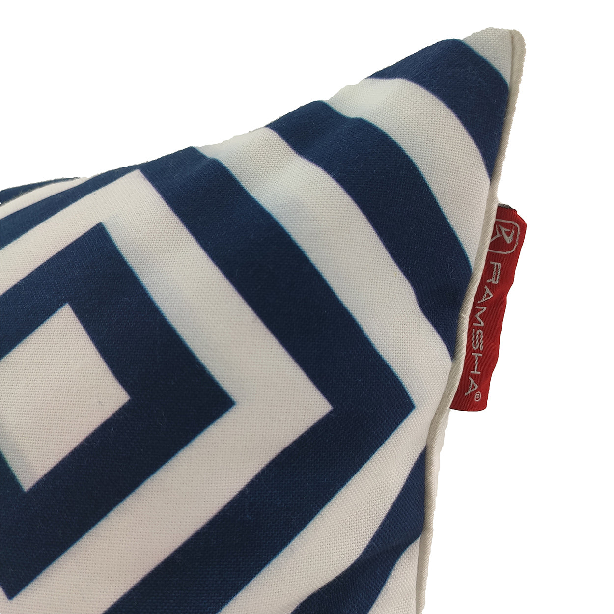 The Polyester Blue & White Cushion Cover CS-116 by RAMSHA HOME features a navy geometric square pattern and a red brand fabric tag—perfect for stylishly enhancing your home decor.