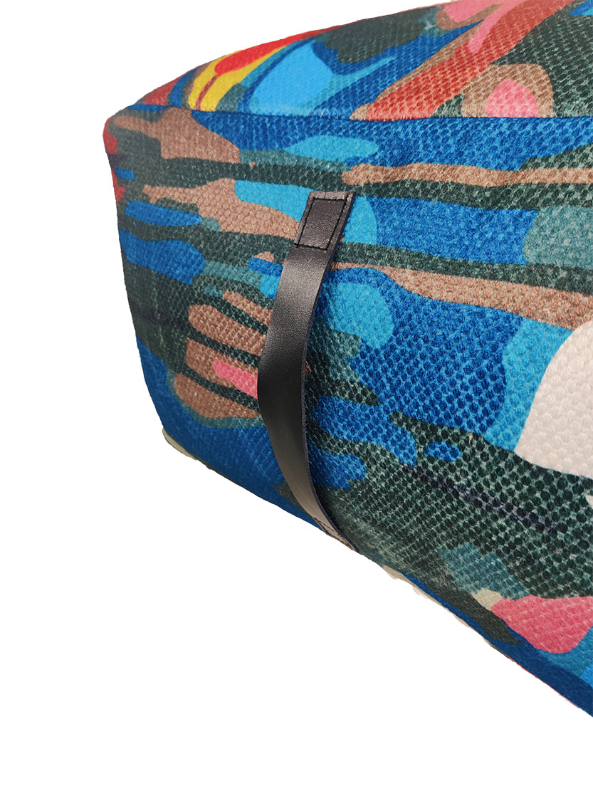 Close-up of PF-121 pouf showing vibrant printed polyester fabric and handle