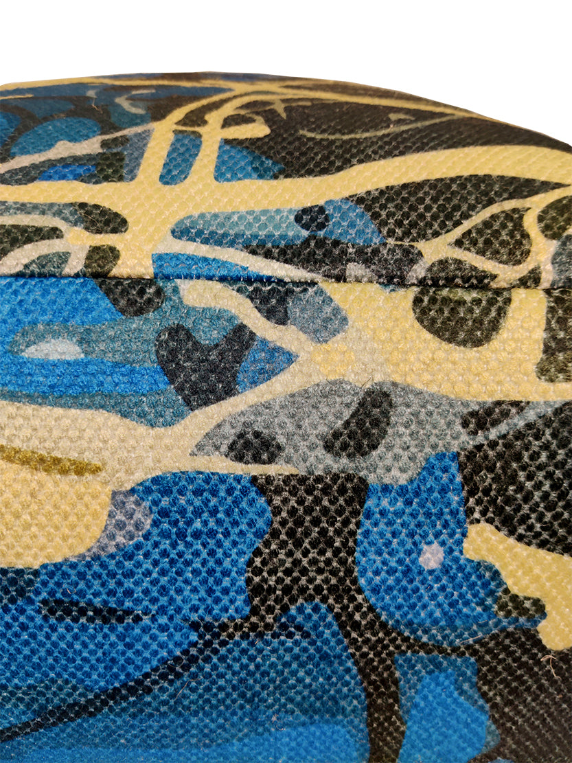 Colorful printed pouf with pedestal base, soft cushion top, and lightweight design