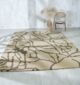 Beautiful handmade silk carpet enhancing a modern living room, from a leading carpet store in Dubai, showcasing the finest rugs UAE.