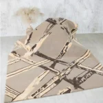 Hand-tufted rug with elegant design, soft texture, and durable craftsmanship for home décor.