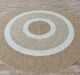 Sideways View of Handmade Braided Wool Floor Rug - Natural & White, Round Shape by Ramsha Home