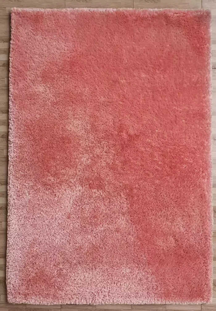 Soft shaggy rug with plush texture, modern design, and cozy comfort for home décor.