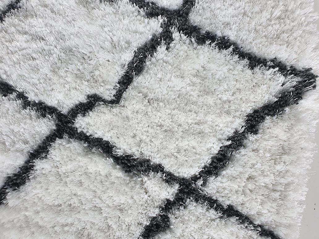 Luxurious Close-up: Ramsha Home's White and Black Line Shaggy Rug - Perfect Blend of Style and Comfort Close-up View of Ramsha Home's White and Black Line Shaggy Rug - Polyester & Cotton Blend - 150 CM Round