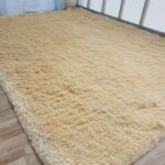 Sideways View of Beige Handmade Shaggy Rug - Ramsha Home