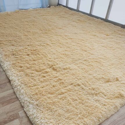 Sideways View of Beige Handmade Shaggy Rug - Ramsha Home