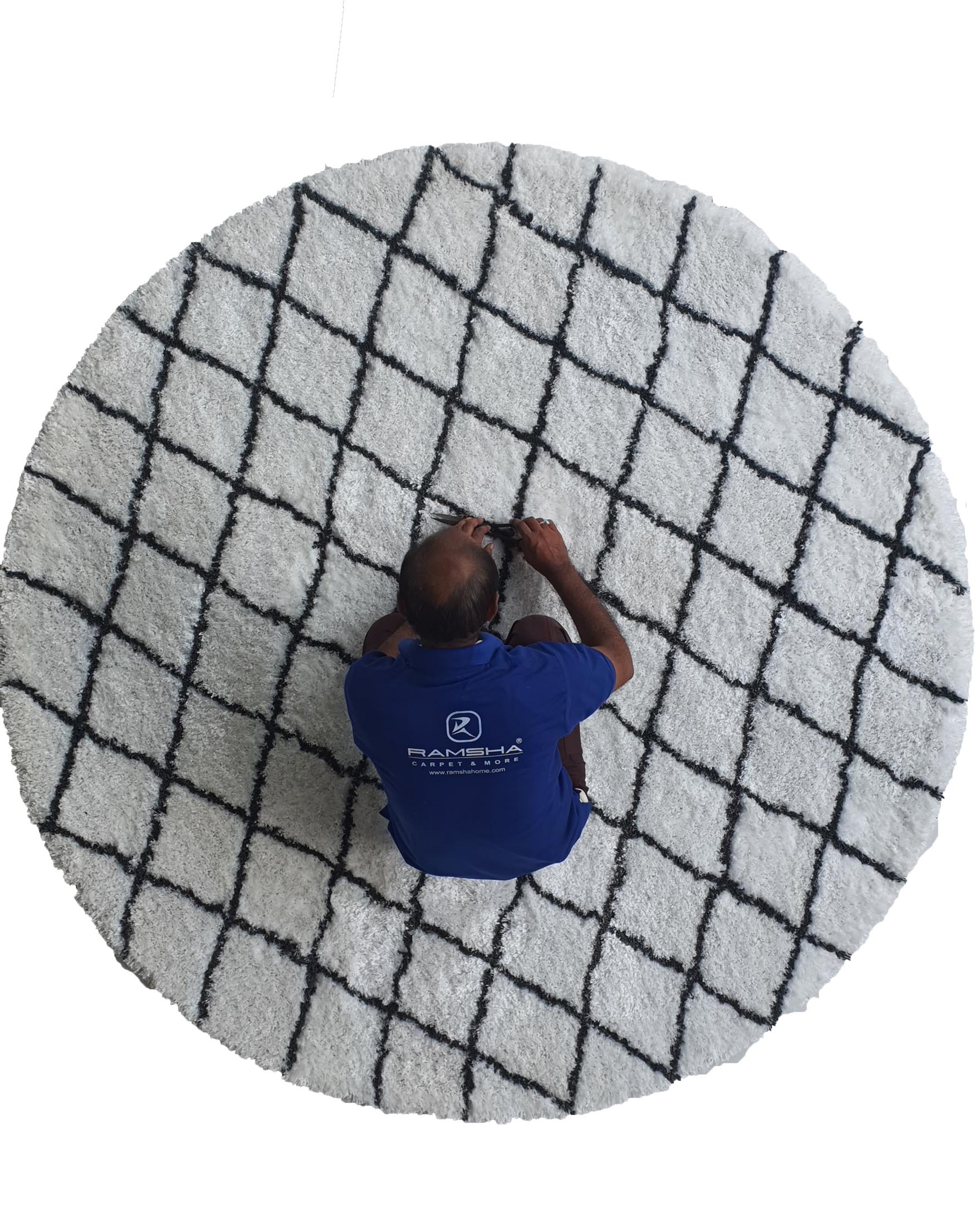 Craftsmanship in Action: Man Working on Ramsha Home's White and Black Line Shaggy Rug - 150 CM Round Top View of Ramsha Home's White and Black Line Shaggy Rug - Polyester & Cotton Blend - 150 CM Round