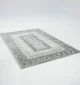 Durable machine-made rug with modern patterns, soft finish, and versatile design for home décor.