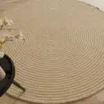 Handmade natural braided jute rug with eco-friendly design, rustic charm, and durable craftsmanship.