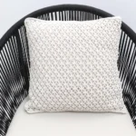 Natural white macrame cushion with handcrafted detailing, soft texture, and stylish home décor appeal.