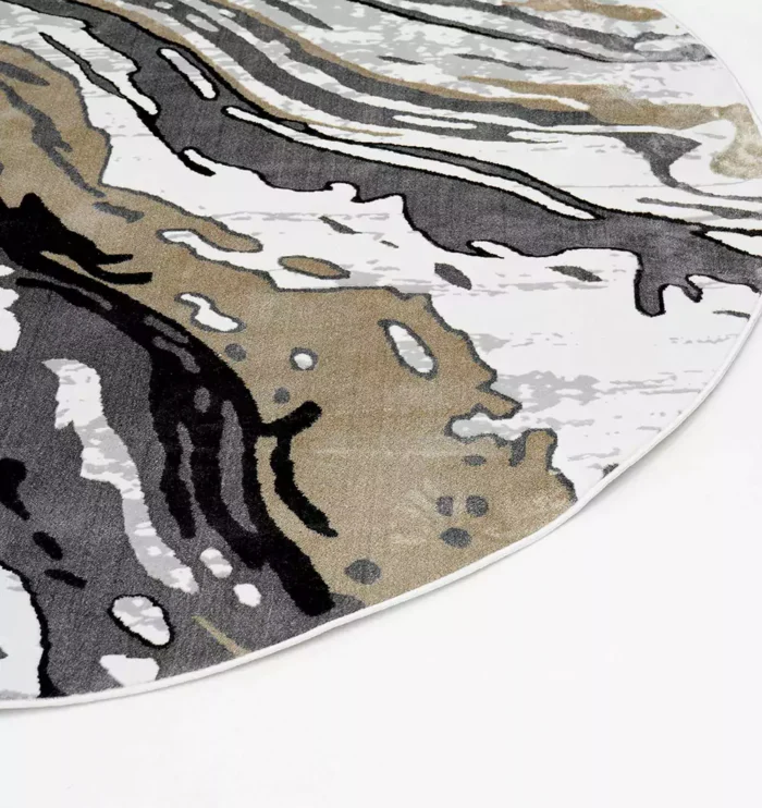 Durable machine-made rug with modern patterns, soft finish, and versatile design for home décor.