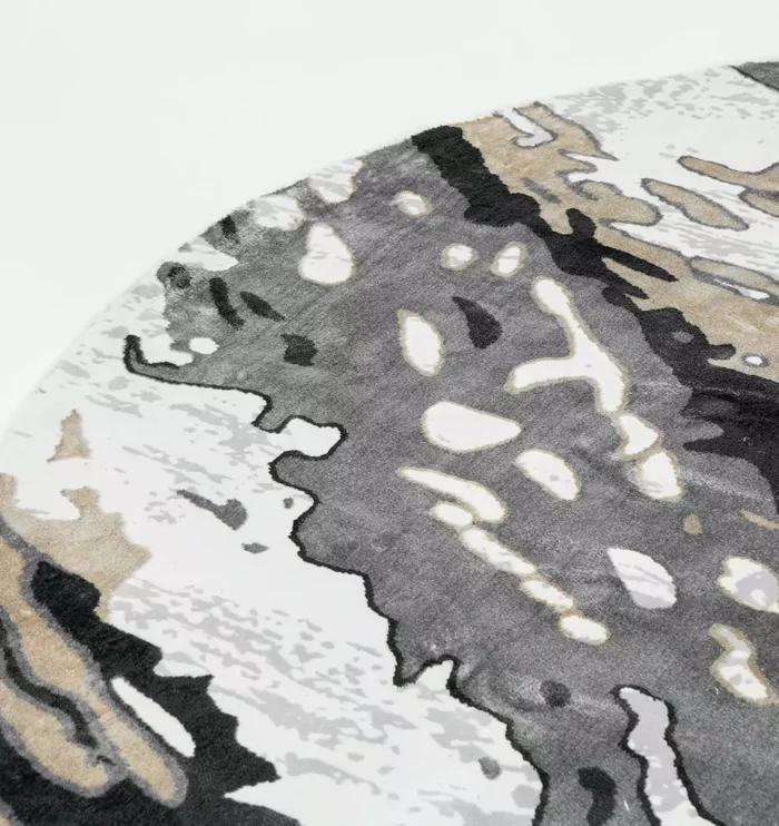Durable machine-made rug with modern patterns, soft finish, and versatile design for home décor.